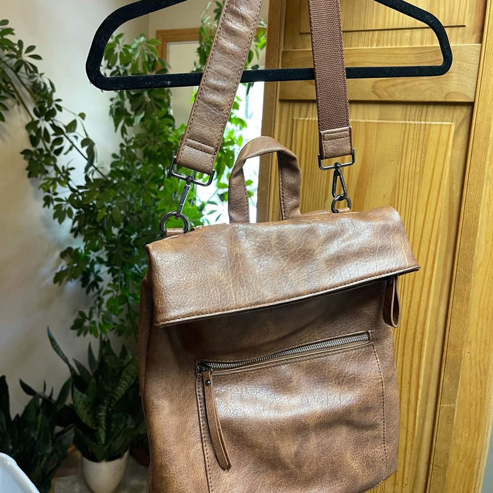 Tan backpack can use it 2 ways